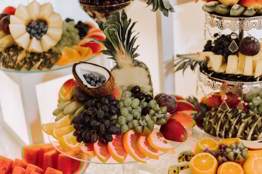 Fruit buffet for a wedding. Assortment of exotic fruits in the restaurant. Various compositions from fresh fruits. photo