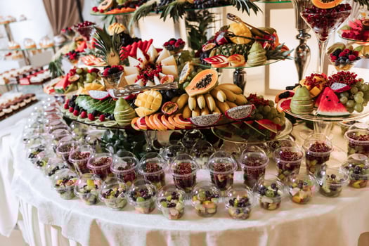 Fruit buffet for a wedding. Assortment of exotic fruits in the restaurant. Various compositions from fresh fruits. photo
