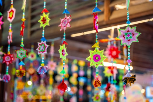 Handmade woven woollen circles hanging and blowing in the wind, Thailand. High quality photo