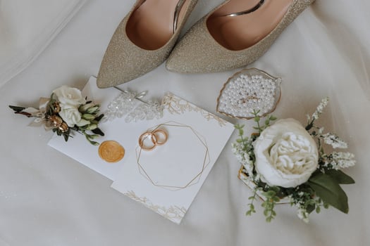 Bride's engagement ring, stilettos, Perfume. Wedding details of the bride. Flowers Beautiful light. wedding dress photo