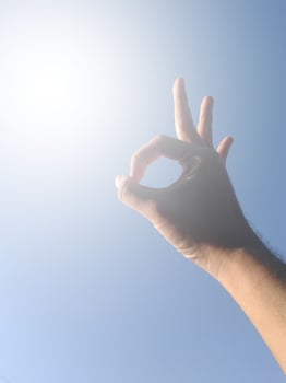 hand with blue sky photo