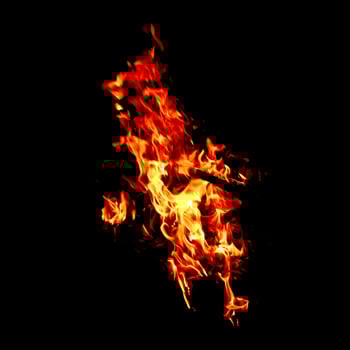 Fire of flame burning isolated on dark background for graphic design purpose photo