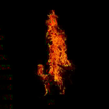 Fire of flame burning isolated on dark background for graphic design purpose photo