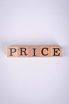 The inscription Price inspection made of wooden cubes on a plain background photo