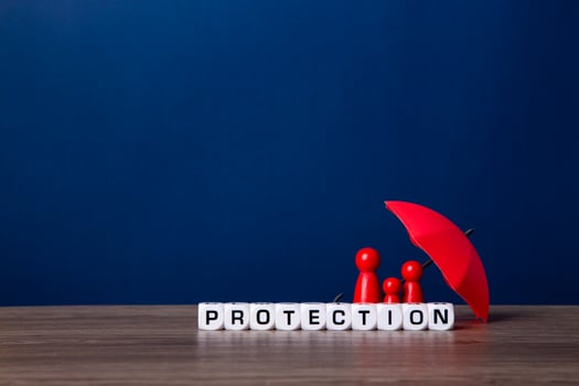 Umbrella and wooden doll figures. photo