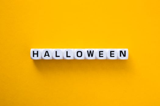 Halloween word on a yellow background. photo