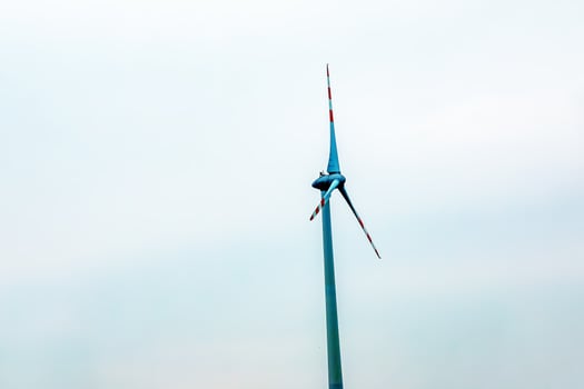 Wind turbine station windmill park next to the road in Austria in cloudy weather. photo