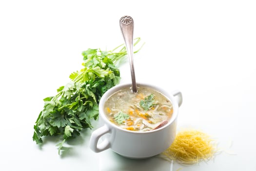 cooked hot soup with noodles and vegetables photo