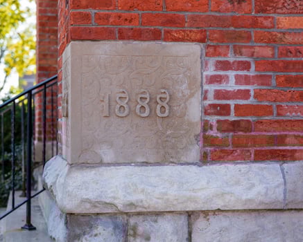 the building cornerstone of a very old but well maintained  church photo
