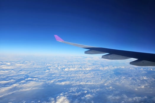 Close up Airplane Wing with Beautiful Blue Sky Background. photo
