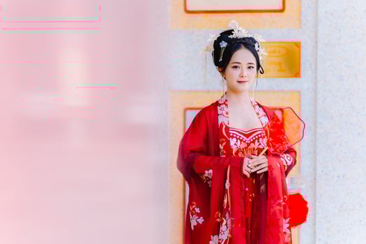 Woman dress China New year. portrait of a woman. person in traditional costume. woman in traditional costume. Beautiful young woman in a bright red dress and a crown of Chinese Queen posing. photo