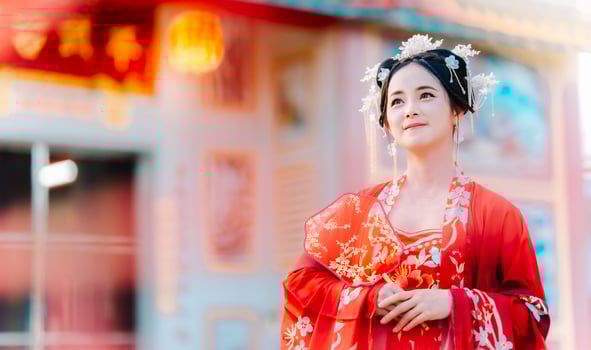 Woman dress China New year. portrait of a woman. person in traditional costume. woman in traditional costume. Beautiful young woman in a bright red dress and a crown of Chinese Queen posing. photo