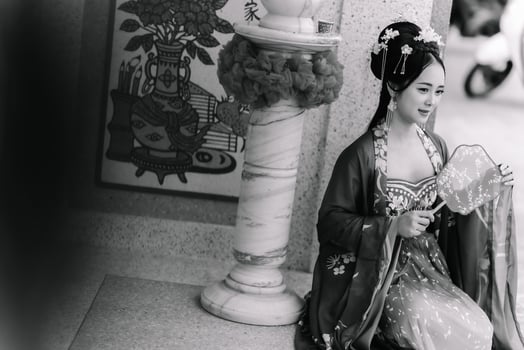 Woman dress China New year. portrait of a woman. person in traditional costume. woman in traditional costume. Beautiful young woman in a bright red dress and a crown of Chinese Queen posing. photo