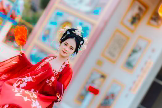 Woman dress China New year. portrait of a woman. person in traditional costume. woman in traditional costume. Beautiful young woman in a bright red dress and a crown of Chinese Queen posing. photo
