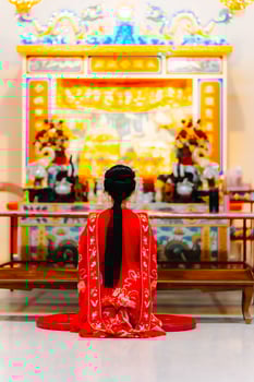 Woman dress China New year. portrait of a woman. person in traditional costume. woman in traditional costume. Beautiful young woman in a bright red dress and a crown of Chinese Queen posing. photo