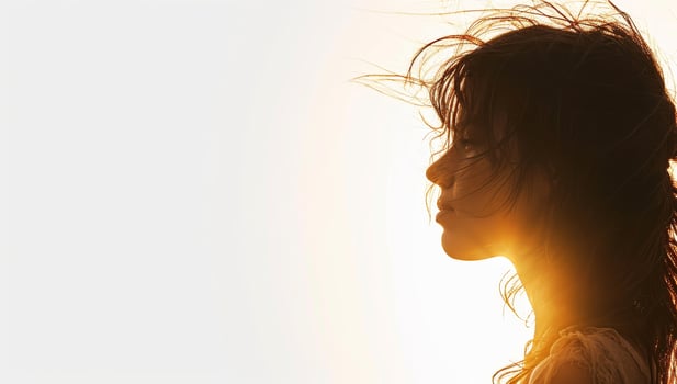 AI generated Silhouette of a beautiful woman with wind blowing her hair. photo