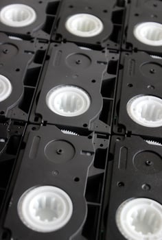 Attached close to each other rare small video cassettes textured surface photo