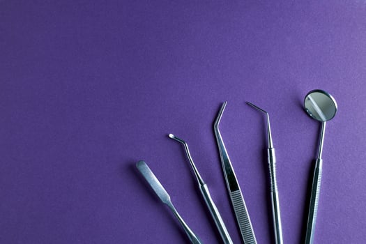 Dentist tools. Professional steel dental instruments with background with free space. photo