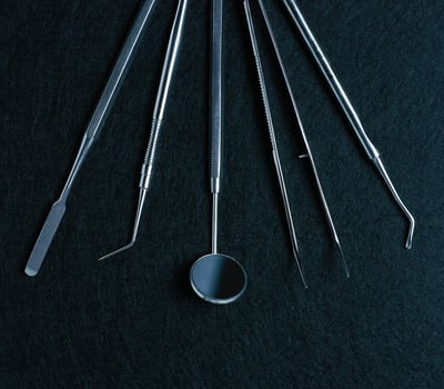 Dental tools on black background photo