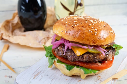 Delicious burger with beef meat, homemade bun and mayo photo