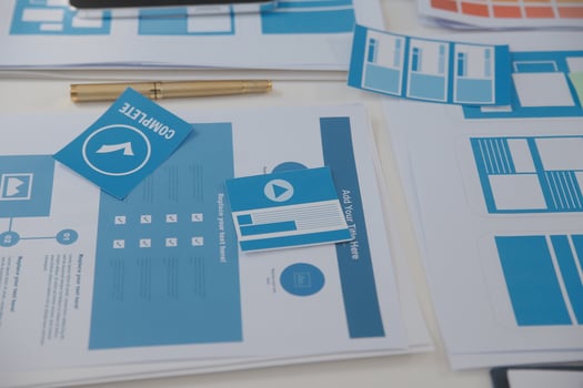 Close up ux developer and ui designer use augmented reality brainstorming about mobile app interface wireframe design on desk at modern office.Creative digital development agency photo