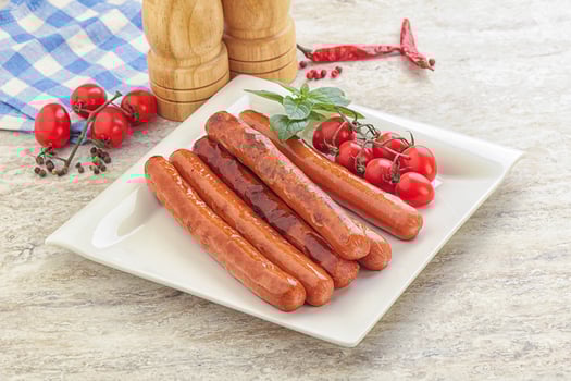 Roasted sausages in the plate photo