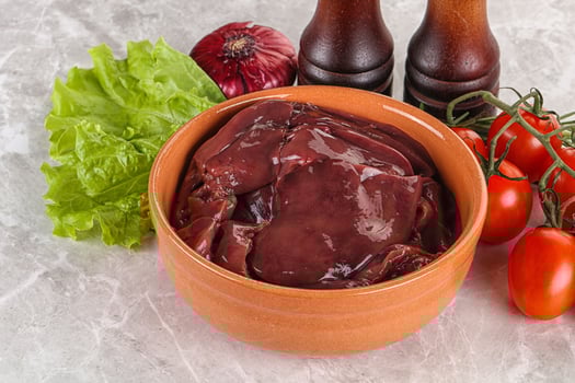 Raw turkey liver in a bowl ready for cooking photo
