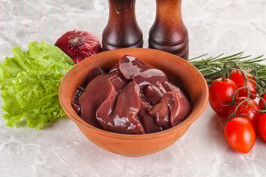 Raw turkey liver in a bowl ready for cooking photo