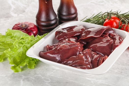 Raw turkey liver in a bowl ready for cooking photo