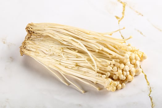 Tasty raw enoki mushroom heap photo