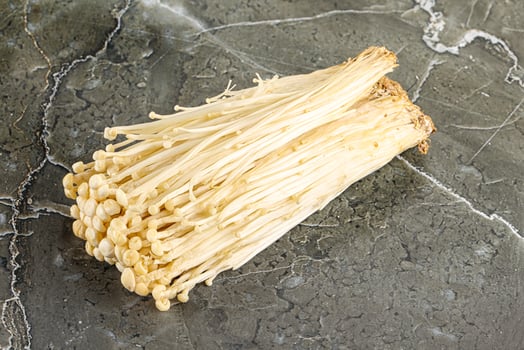 Tasty raw enoki mushroom heap photo