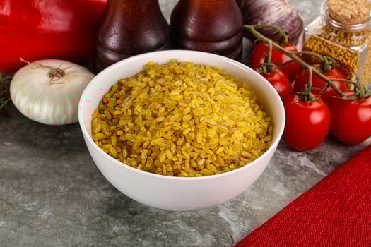 Dry wheat bulgur cereal heap photo