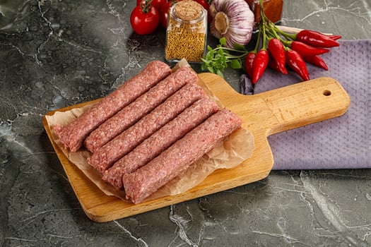 Raw beef kebab sausage for grill photo
