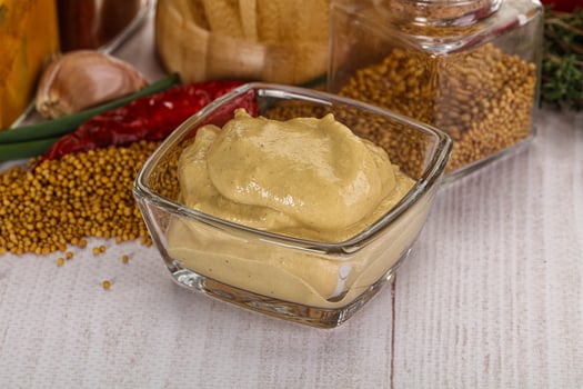 Dijon mustard sauce in the bowl photo