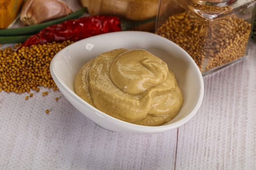 Dijon mustard sauce in the bowl photo