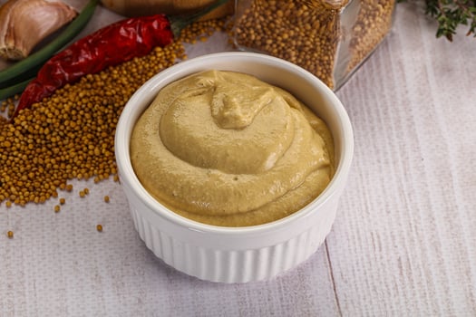 Dijon mustard sauce in the bowl photo