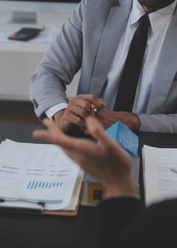 Real estate agent and Sales manager team analysis pricing of rental lease contract of sale purchase agreement, concerning mortgage loan offer for and house insurance. photo