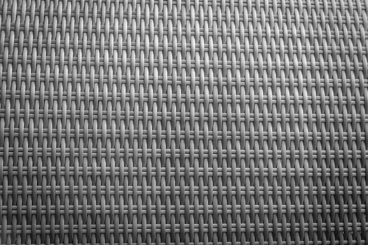 Synthetic rattan texture weaving background as used on outdoor garden furniture. photo