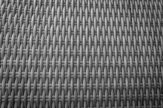 Synthetic rattan texture weaving background as used on outdoor garden furniture. photo
