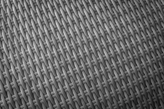 Synthetic rattan texture weaving background as used on outdoor garden furniture. photo