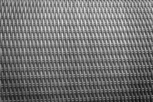 Synthetic rattan texture weaving background as used on outdoor garden furniture. photo