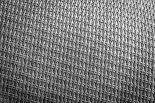 Synthetic rattan texture weaving background as used on outdoor garden furniture. photo
