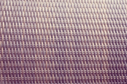 Synthetic rattan texture weaving background as used on outdoor garden furniture. photo