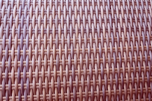 Synthetic rattan texture weaving background as used on outdoor garden furniture. photo