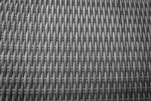 Synthetic rattan texture weaving background as used on outdoor garden furniture. photo