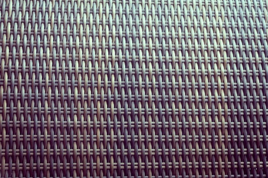 Synthetic rattan texture weaving background as used on outdoor garden furniture. photo