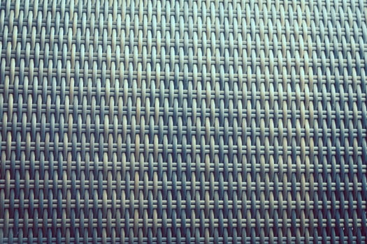 Synthetic rattan texture weaving background as used on outdoor garden furniture. photo
