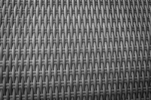 Synthetic rattan texture weaving background as used on outdoor garden furniture. photo