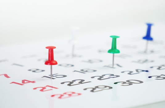 push pin on calendar background photo