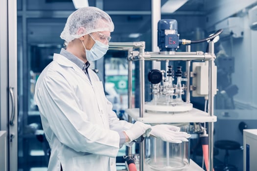 Scientist man working Cannabis CBD oil extraction for medical Science lab. Hemp oil extraction Thin Film Distillation Machine in Laboratory Plants Process. photo